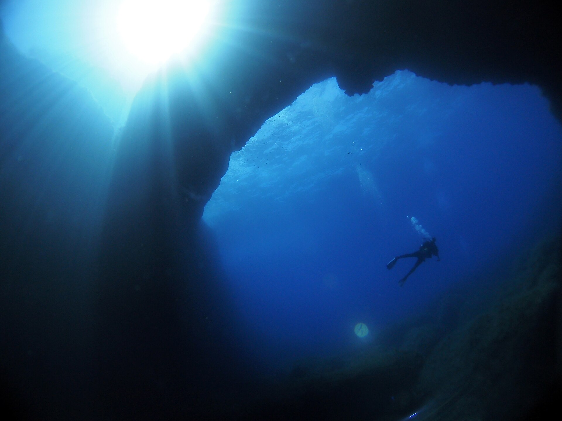 Divers inside the real Blue Hole at Dwejra, Gozo